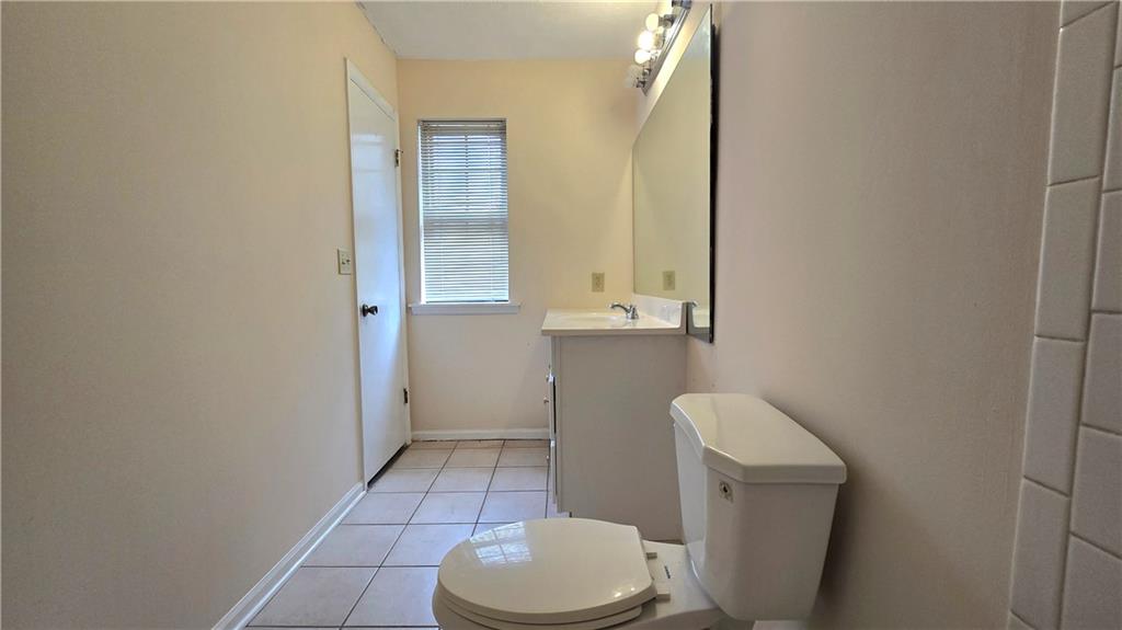 4722 Old Highgate Entry Stone Mountain, GA 30083 - Photo 22 of 31 a bathroom with a toilet and a sink