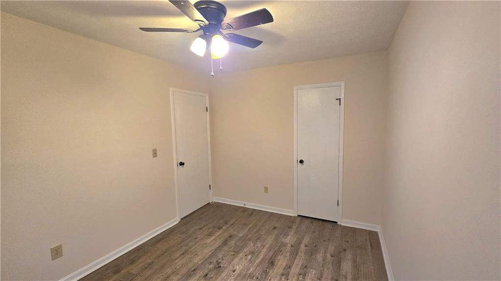 4722 Old Highgate Entry Stone Mountain, GA 30083 - Photo 25 of 31 wooden floor in an empty room