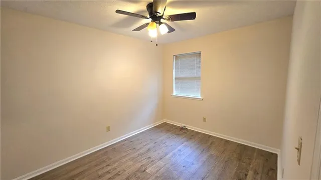 a bathroom with a granite countertop toilet a sink and a bathtub