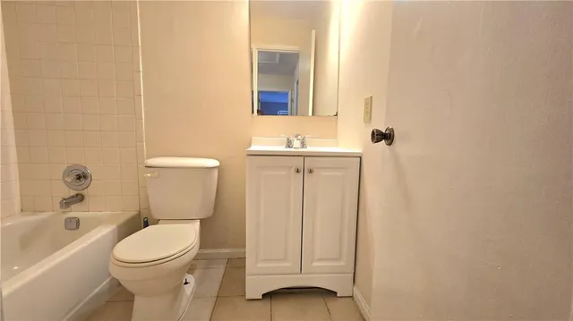 a bathroom with a toilet and a bathtub