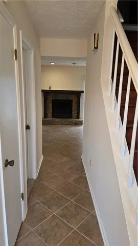 a view of an entryway with fireplace