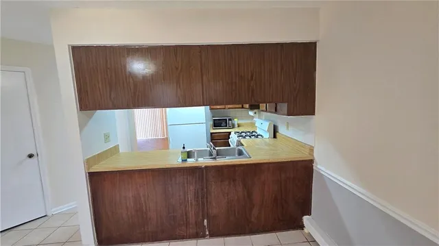 a room with a sink and a washer