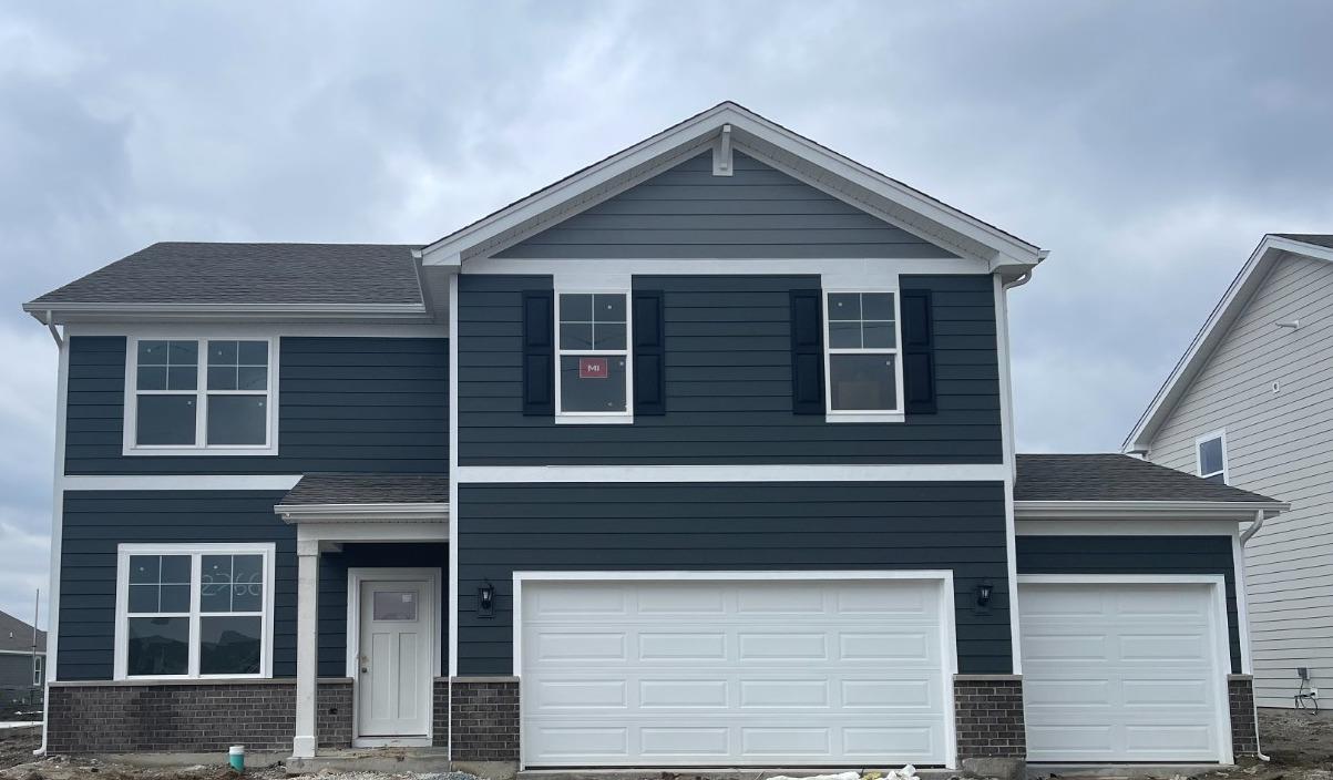 7718 West 103rd Street Crown Point, IN 46307 - Photo 1 of 47 a front view of a house with a yard