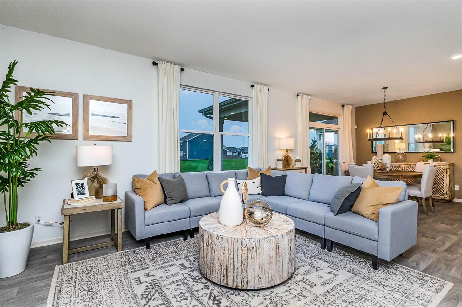 7718 West 103rd Street Crown Point, IN 46307 - Photo 12 of 47 a living room with furniture and a large window