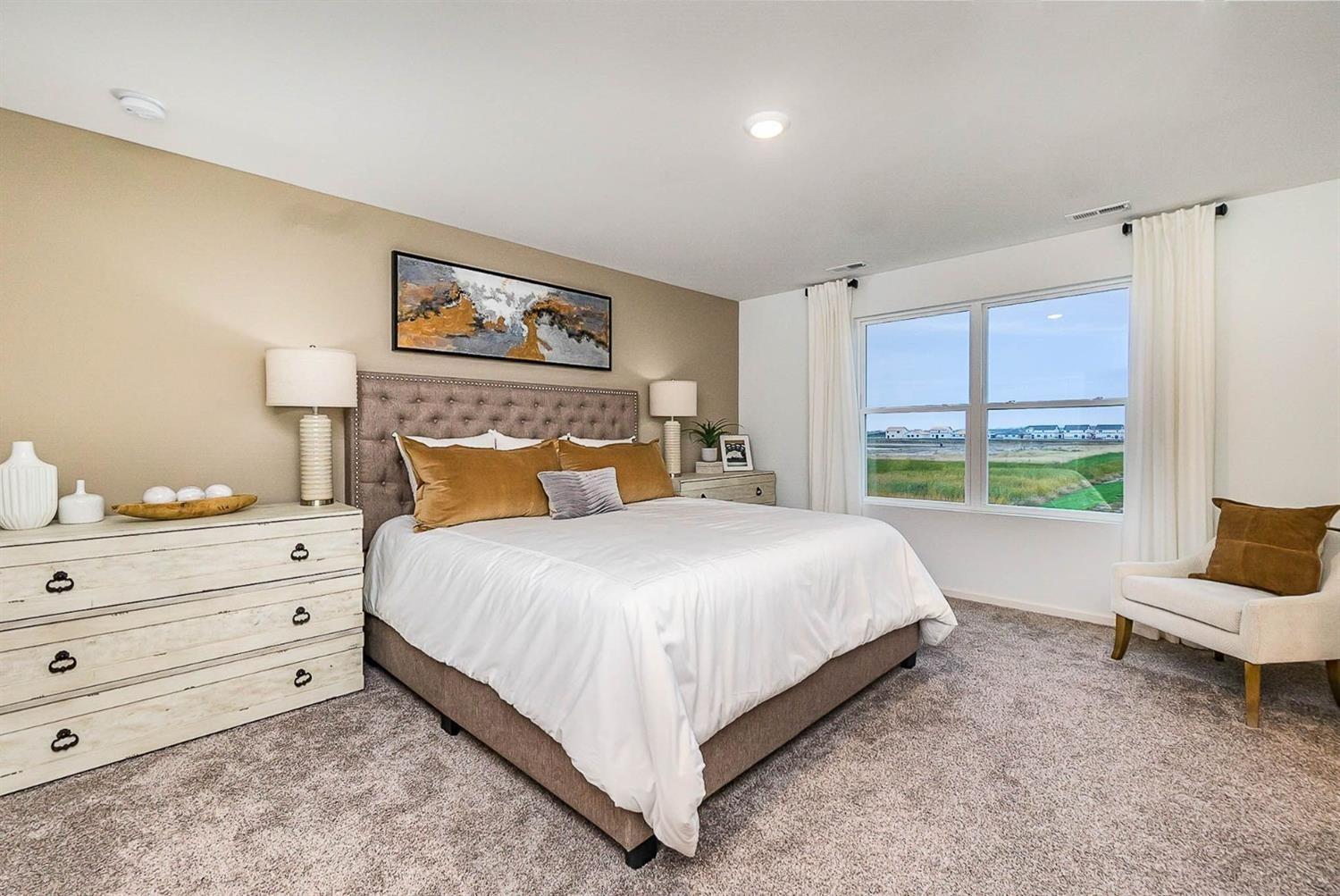 7718 West 103rd Street Crown Point, IN 46307 - Photo 19 of 47 a bedroom with a bed and a large window