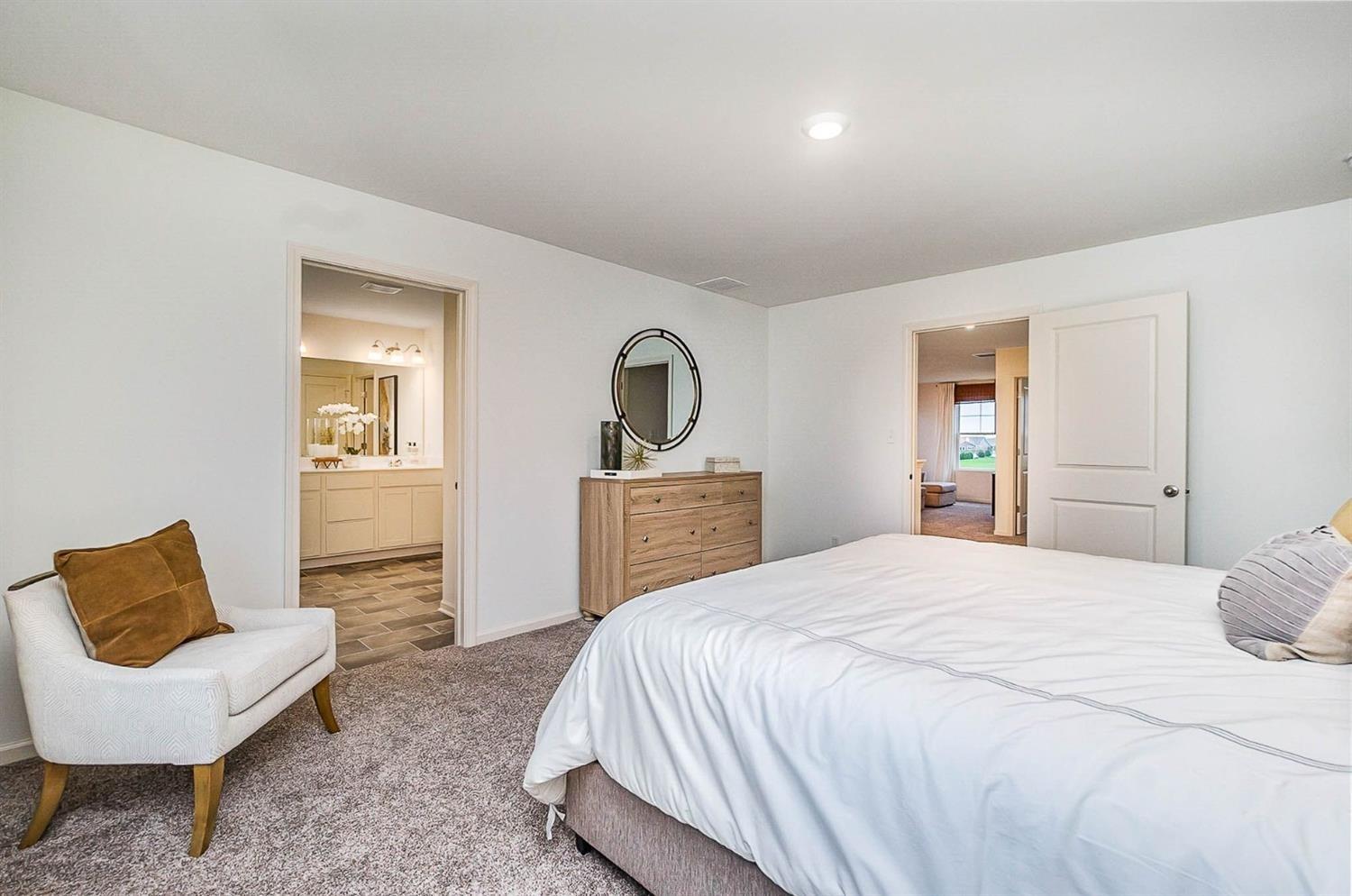 7718 West 103rd Street Crown Point, IN 46307 - Photo 20 of 47 a bedroom with a bed and a couch