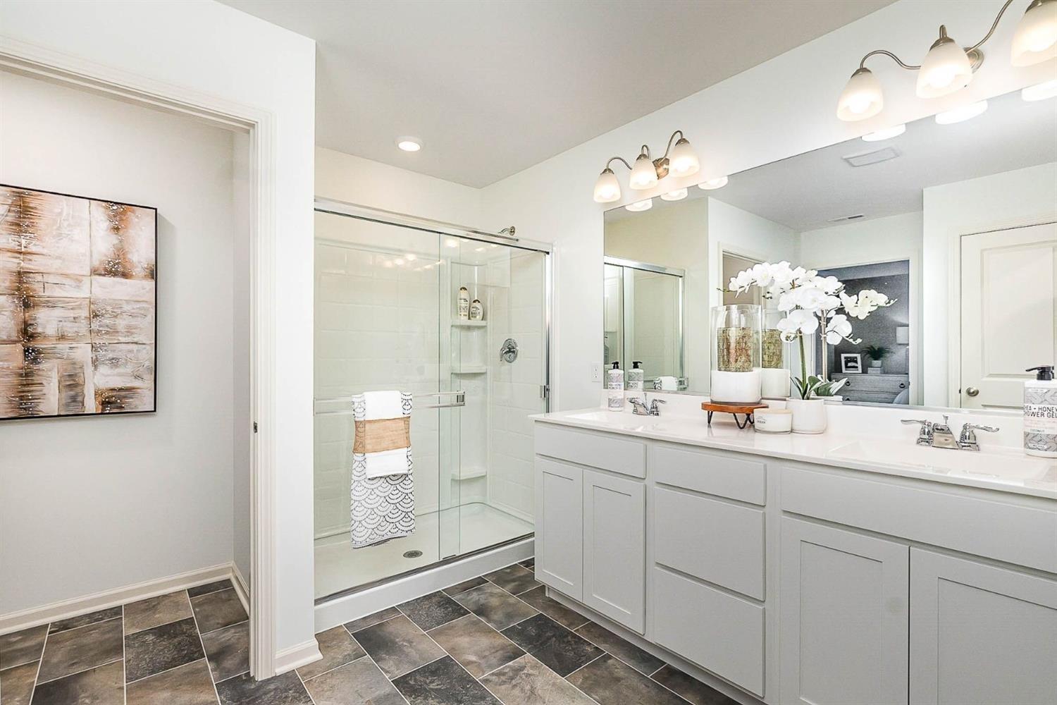 7718 West 103rd Street Crown Point, IN 46307 - Photo 21 of 47 a bathroom with a double vanity sink mirror and double