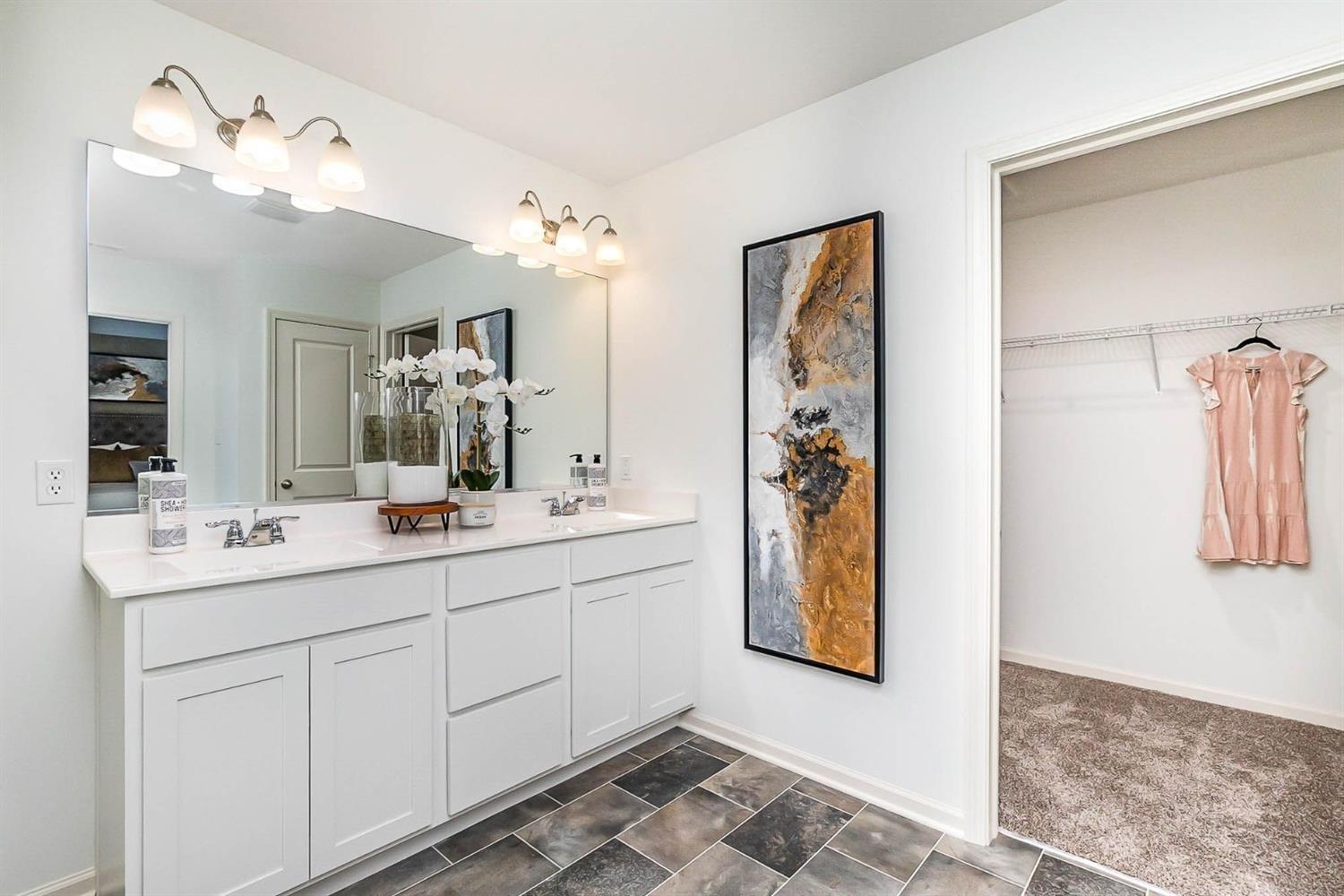 7718 West 103rd Street Crown Point, IN 46307 - Photo 22 of 47 a bathroom with a double vanity sink and a mirror