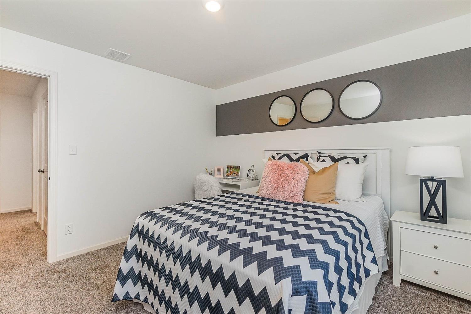 7718 West 103rd Street Crown Point, IN 46307 - Photo 25 of 47 a bedroom with a bed and window