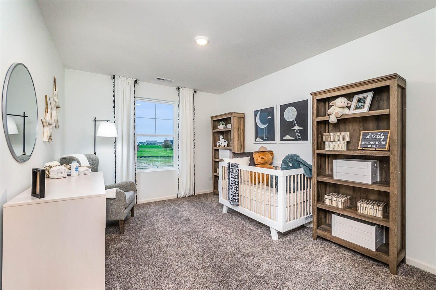 7718 West 103rd Street Crown Point, IN 46307 - Photo 28 of 47 a living room with furniture and a flat screen tv