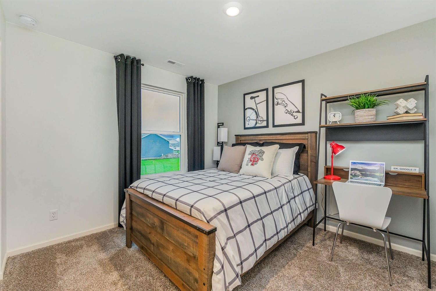 7718 West 103rd Street Crown Point, IN 46307 - Photo 30 of 47 a bedroom with a bed and a window