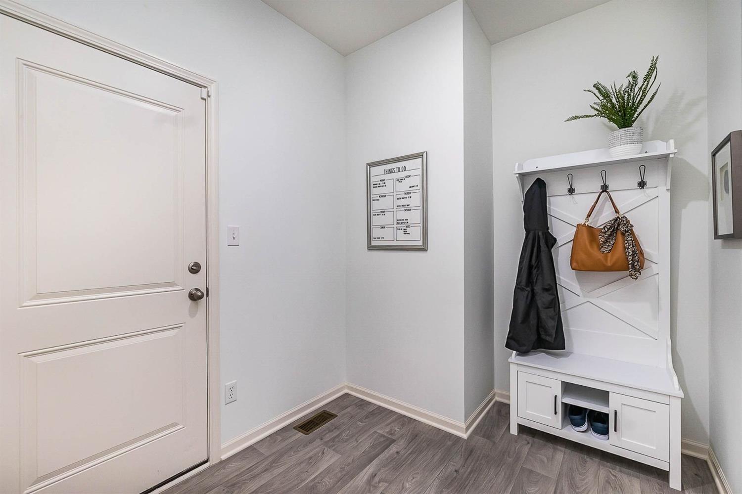 7718 West 103rd Street Crown Point, IN 46307 - Photo 32 of 47 a view of walk in closet with clothes and shoes