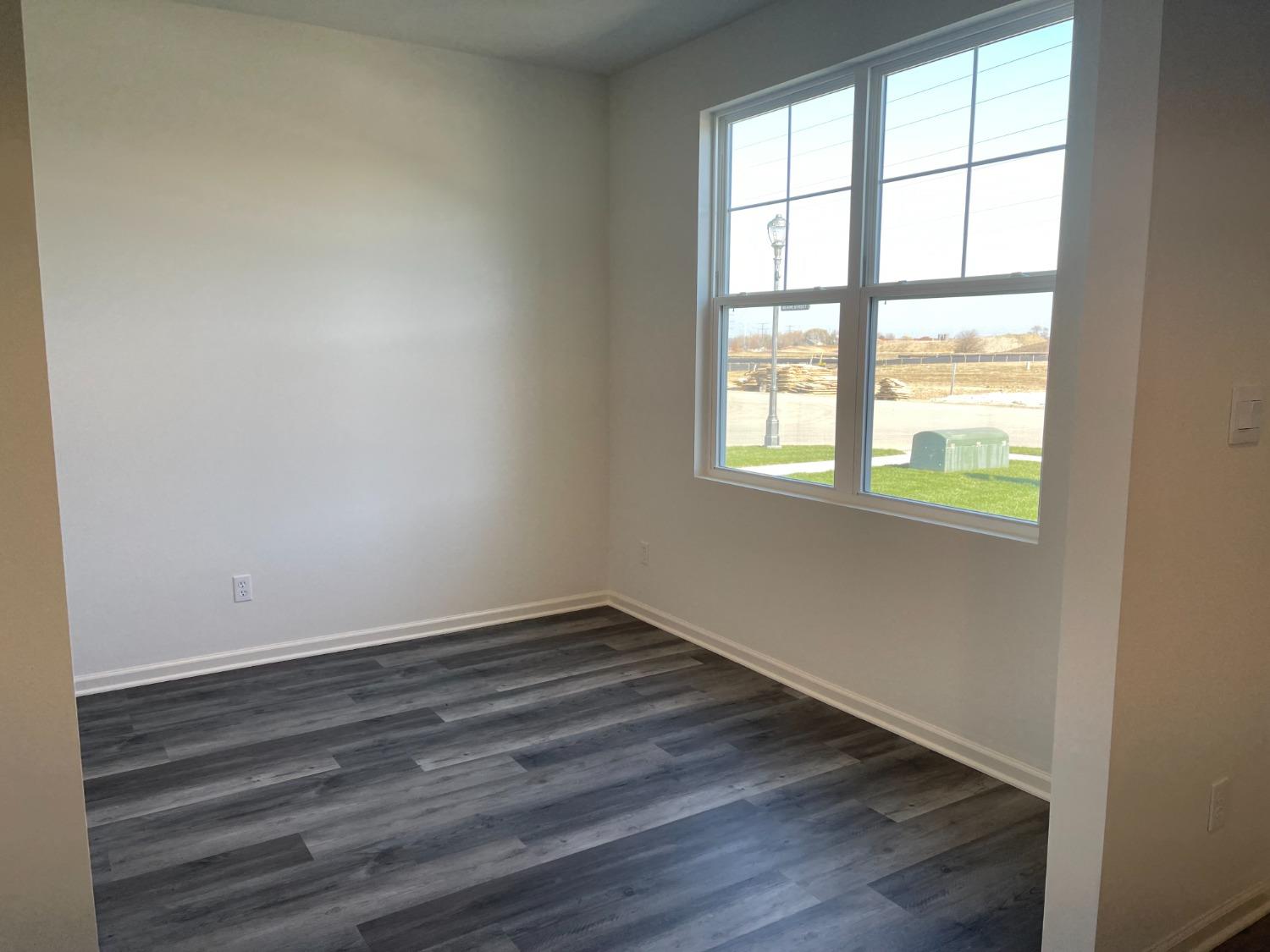 7718 West 103rd Street Crown Point, IN 46307 - Photo 33 of 47 an empty room with wooden floor and windows