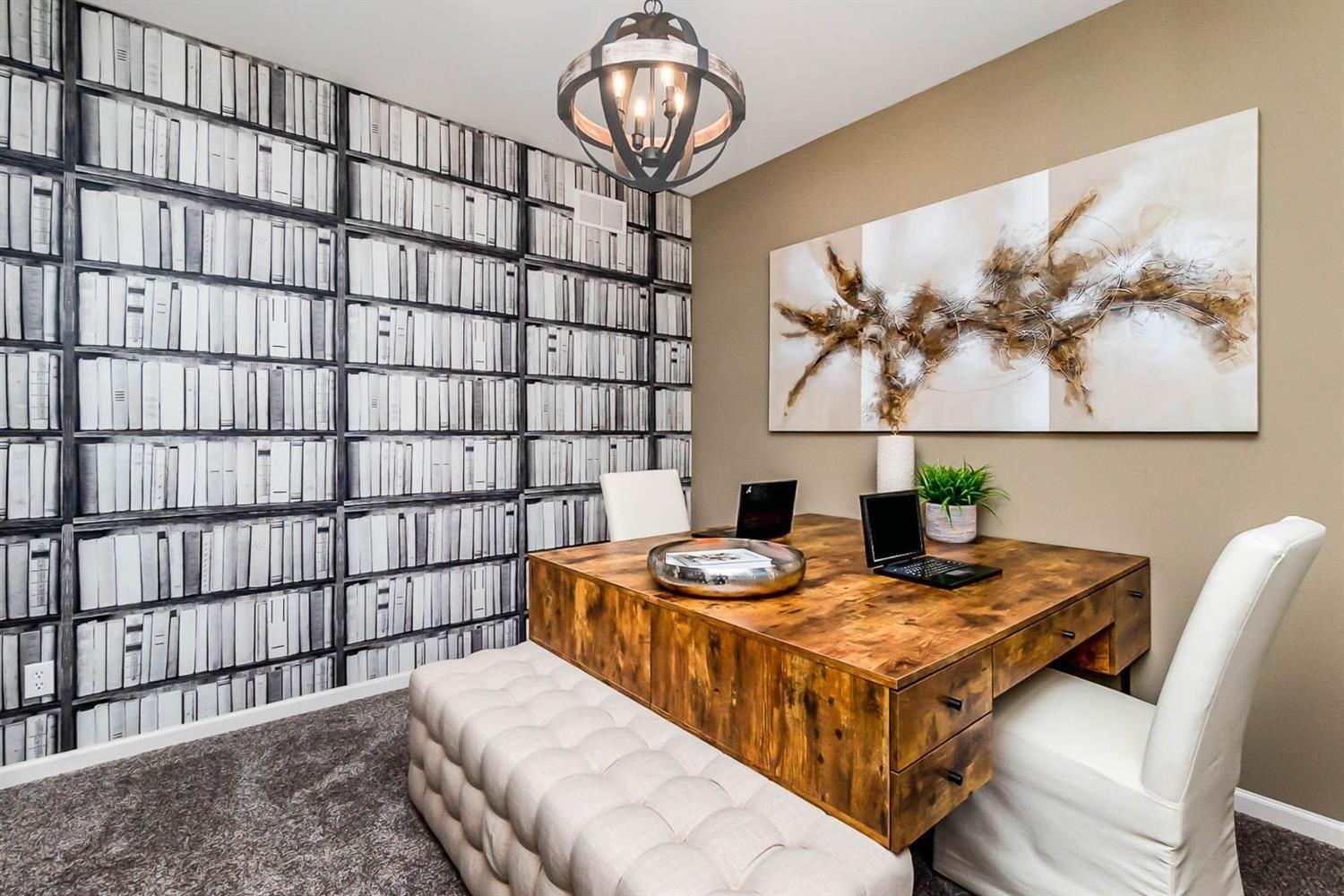 7718 West 103rd Street Crown Point, IN 46307 - Photo 4 of 47 a living room with stainless steel appliances furniture a rug and a window