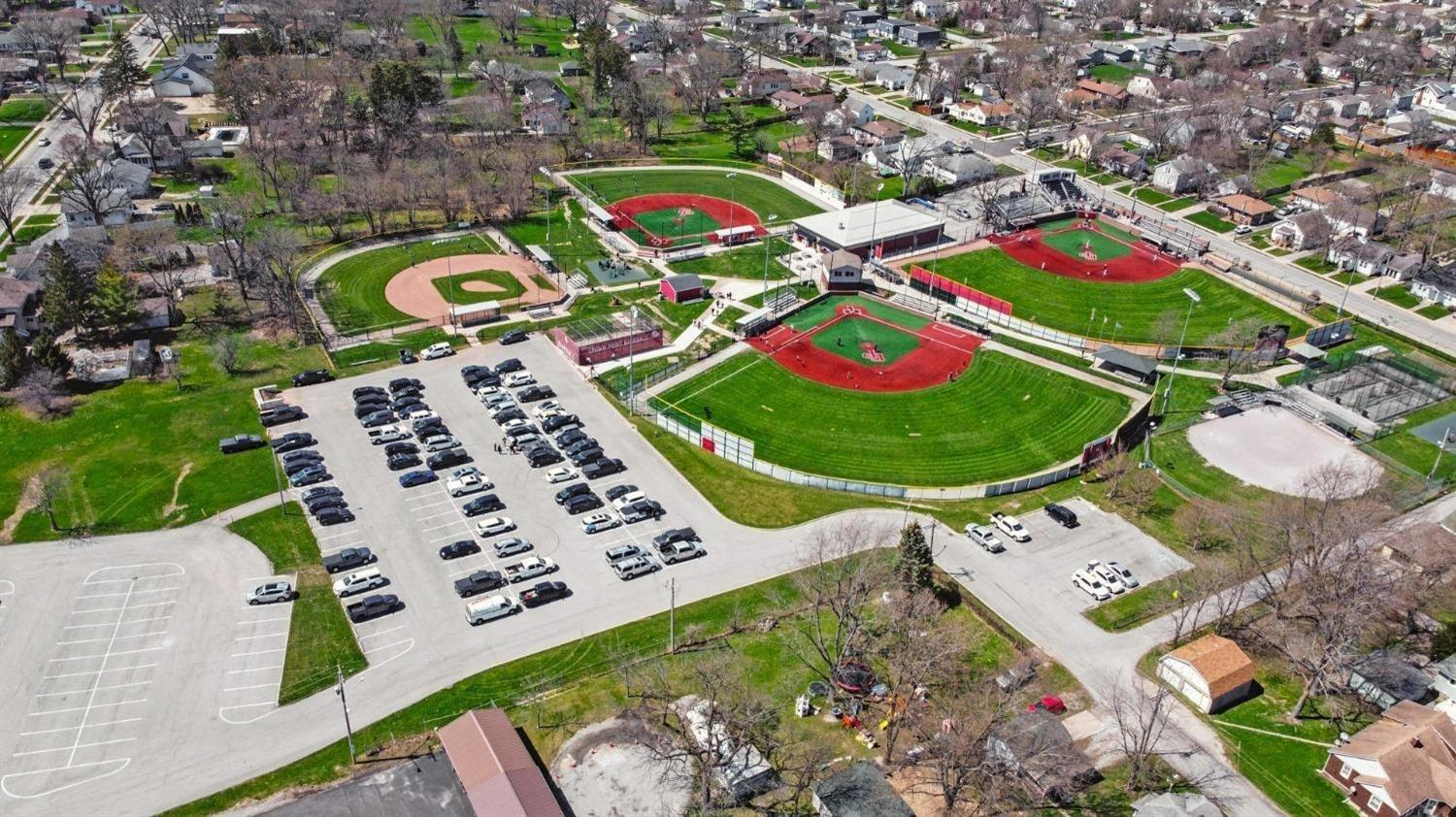 7718 West 103rd Street Crown Point, IN 46307 - Photo 46 of 47 an aerial view of a swimming pool outdoor seating and yard