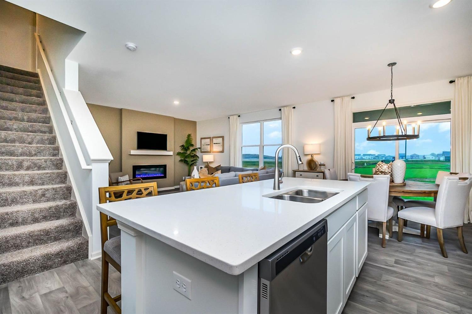 7718 West 103rd Street Crown Point, IN 46307 - Photo 10 of 47 a kitchen with a sink a counter top space and appliances