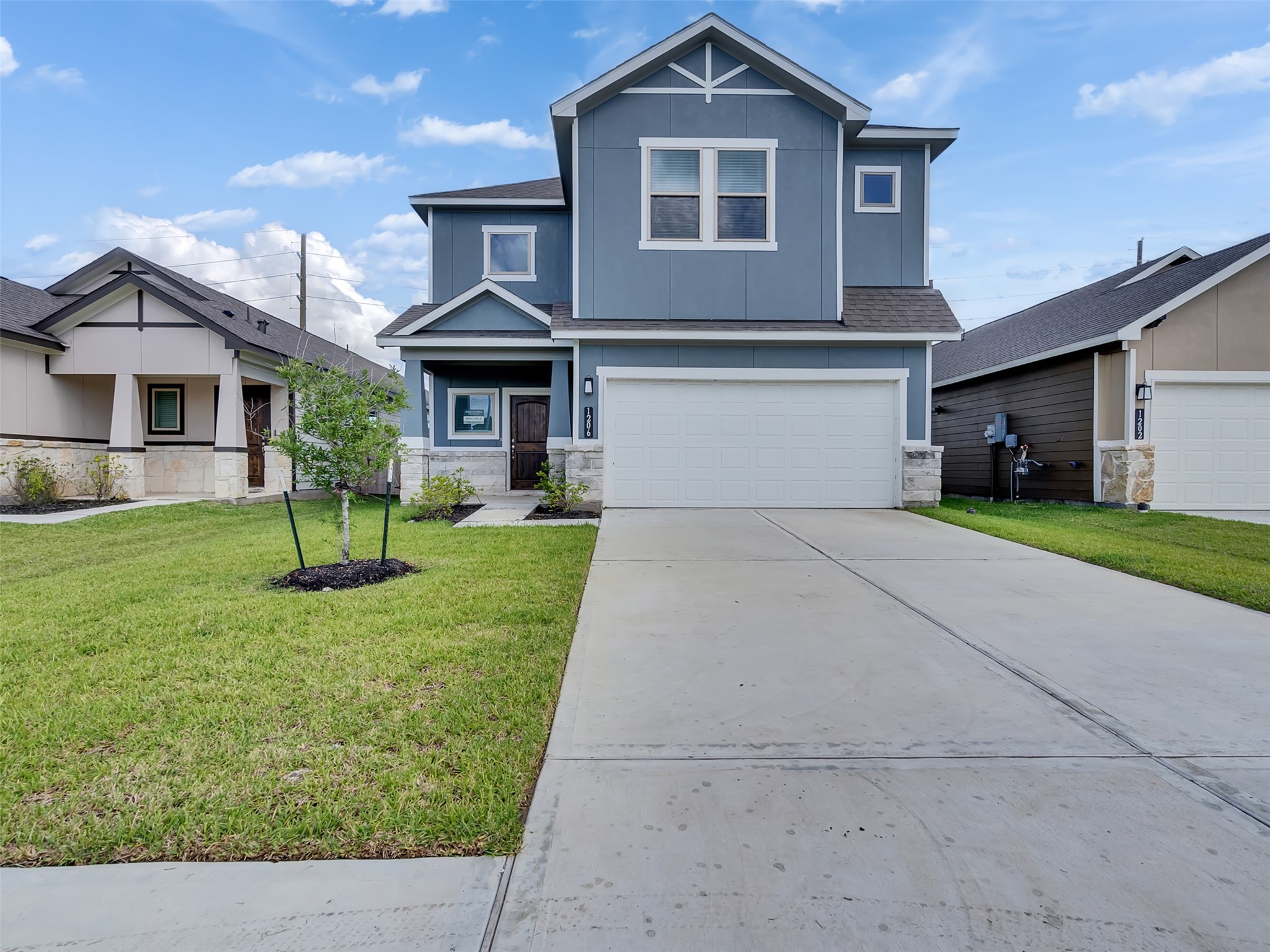 1206 Elsinore Drive Rosharon, TX 77583 - Photo 1 of 21 a front view of a house with a yard and garage