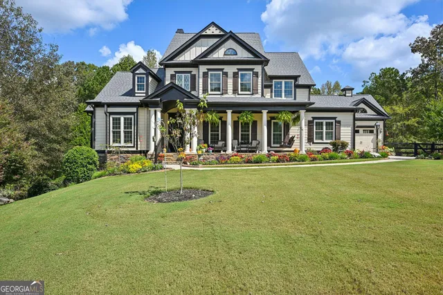 a front view of a house with a yard table and chairs