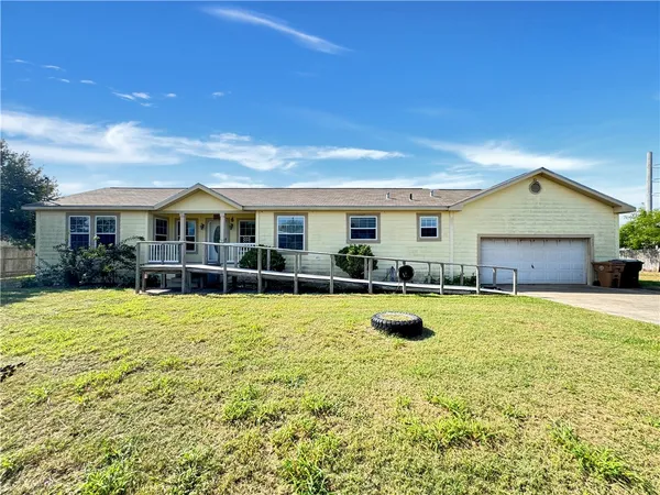 a view of a house with swimming pool and porch
