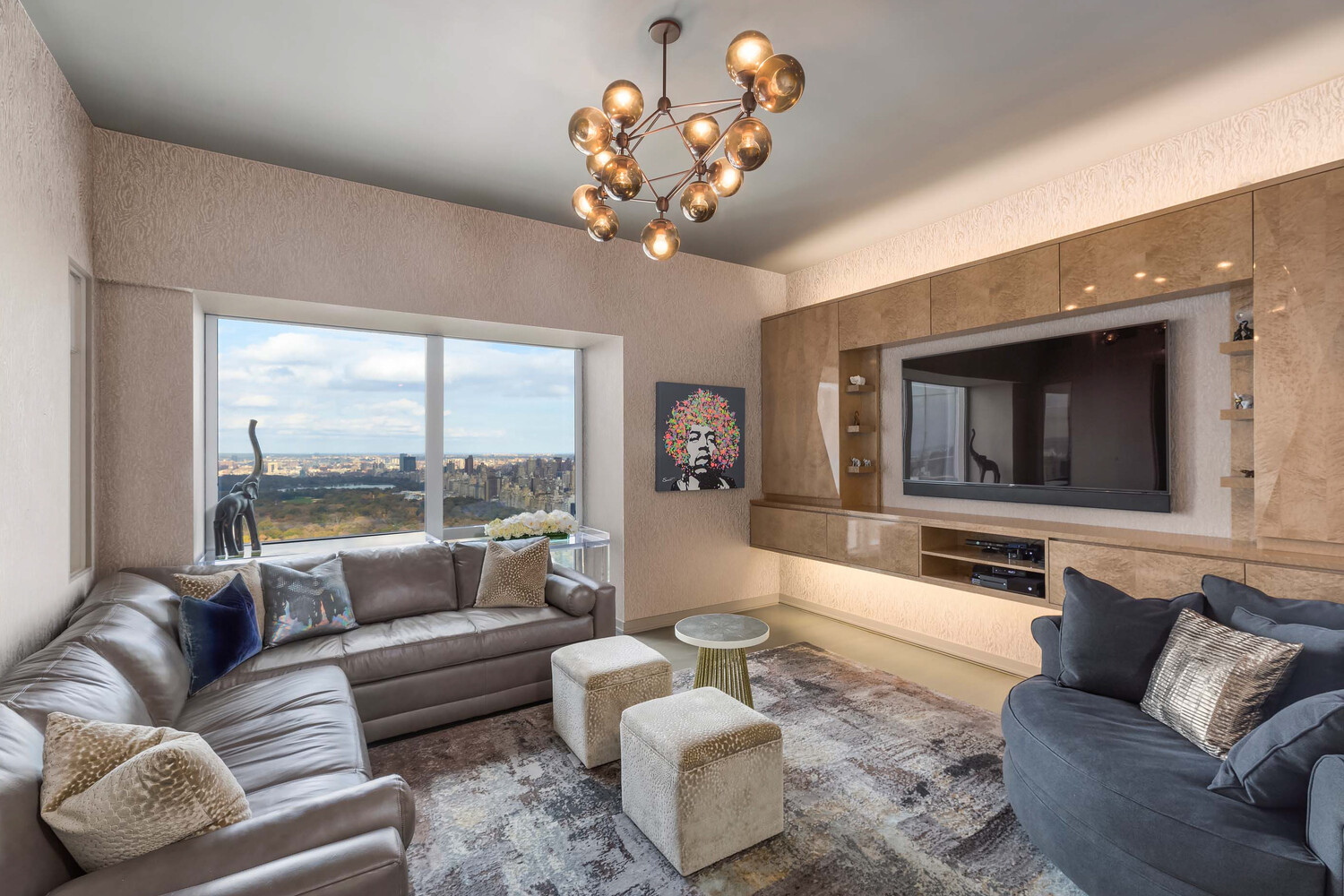 157 West 57th Street, Unit 52/53B Manhattan, NY 10019 - Photo 12 of 20 a living room with furniture and a large window