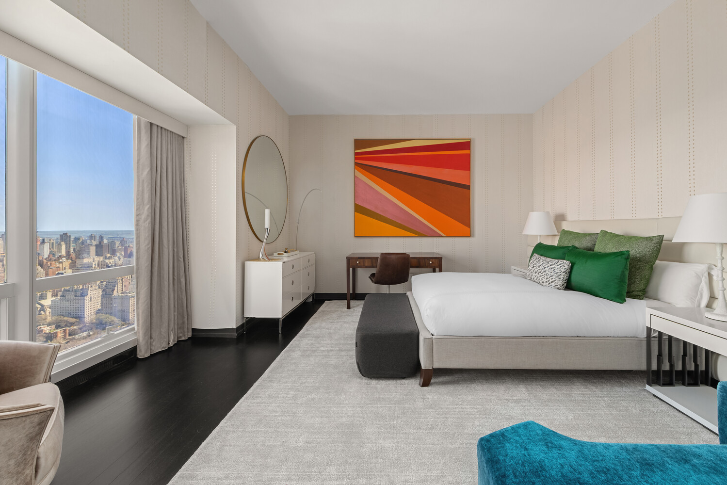 157 West 57th Street, Unit 52/53B Manhattan, NY 10019 - Photo 17 of 20 a bedroom with a bed couch and a window