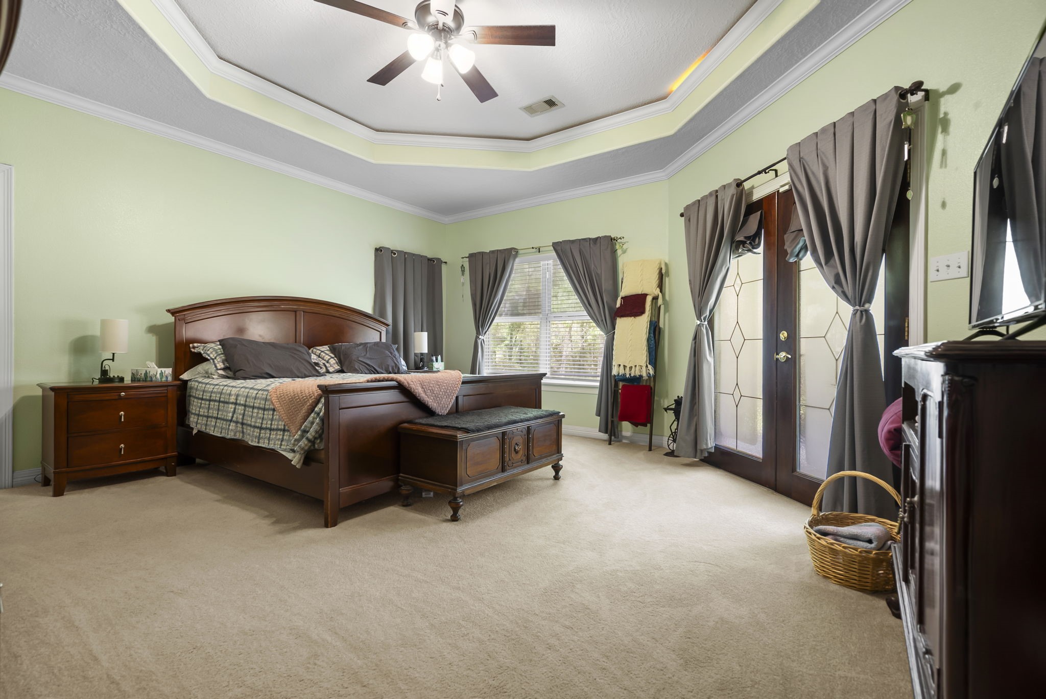 15524 Jim Branch Road Dayton, TX 77535 - Photo 12 of 40 a bedroom with a bed couch and a large window