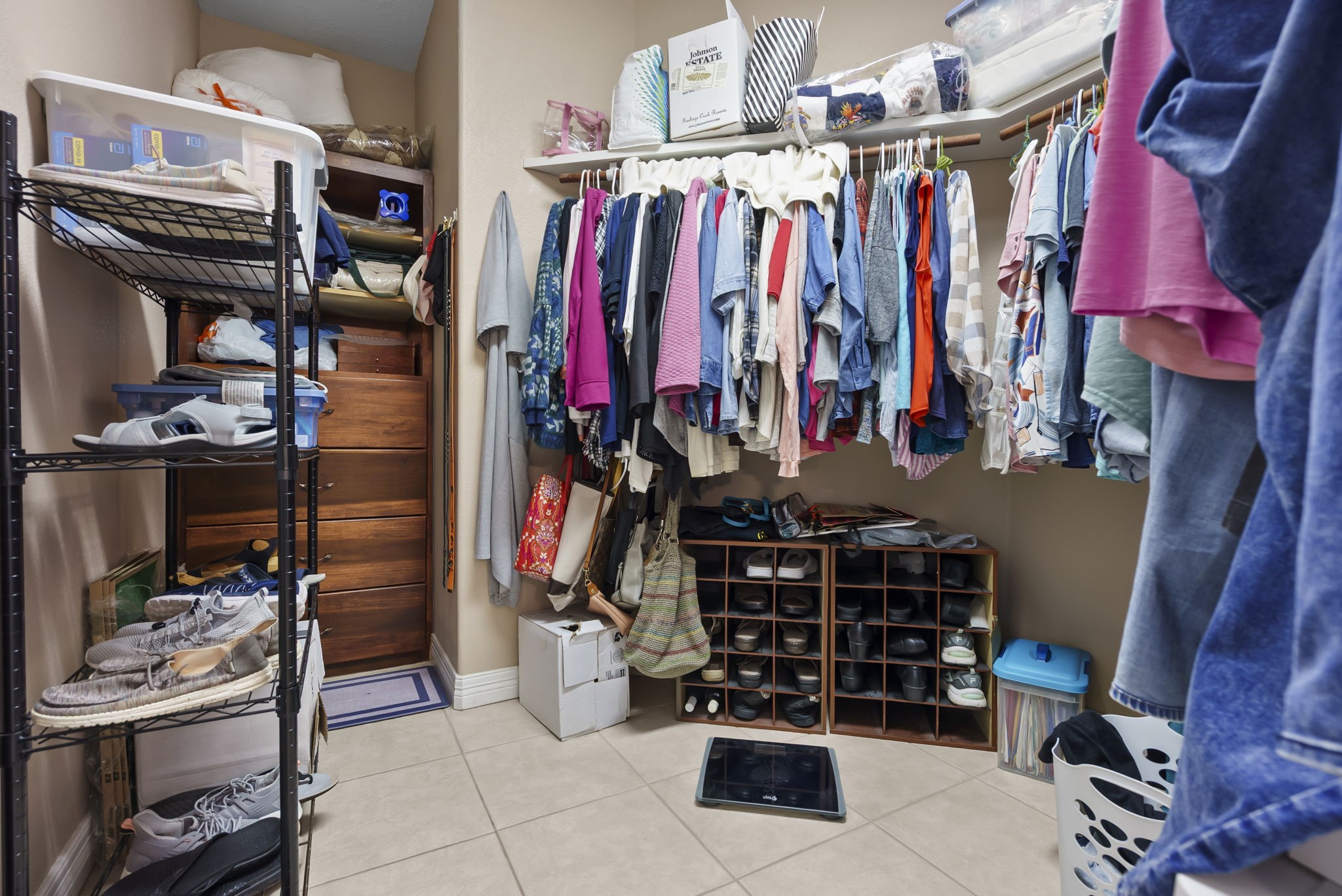 15524 Jim Branch Road Dayton, TX 77535 - Photo 16 of 40 a view of walk in closet with clothes and shoes
