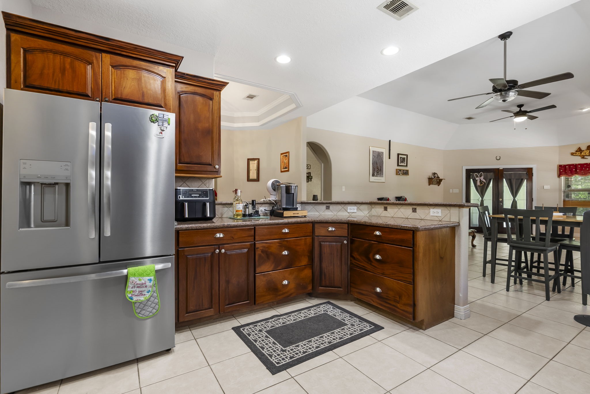 15524 Jim Branch Road Dayton, TX 77535 - Photo 21 of 40 a kitchen with stainless steel appliances granite countertop a refrigerator a sink and a stove