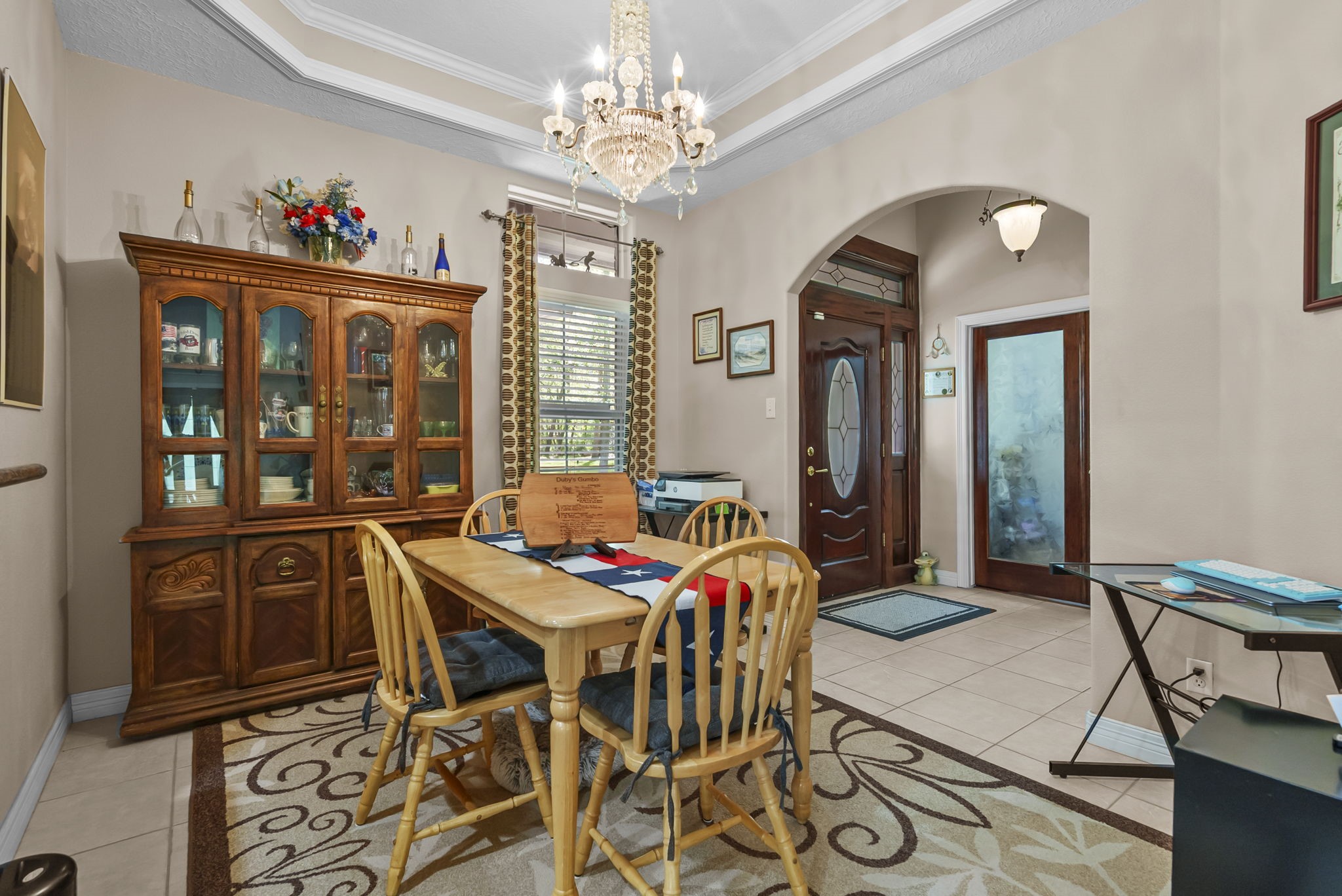 15524 Jim Branch Road Dayton, TX 77535 - Photo 25 of 40 a view of a dining room with furniture a chandelier and wooden floor