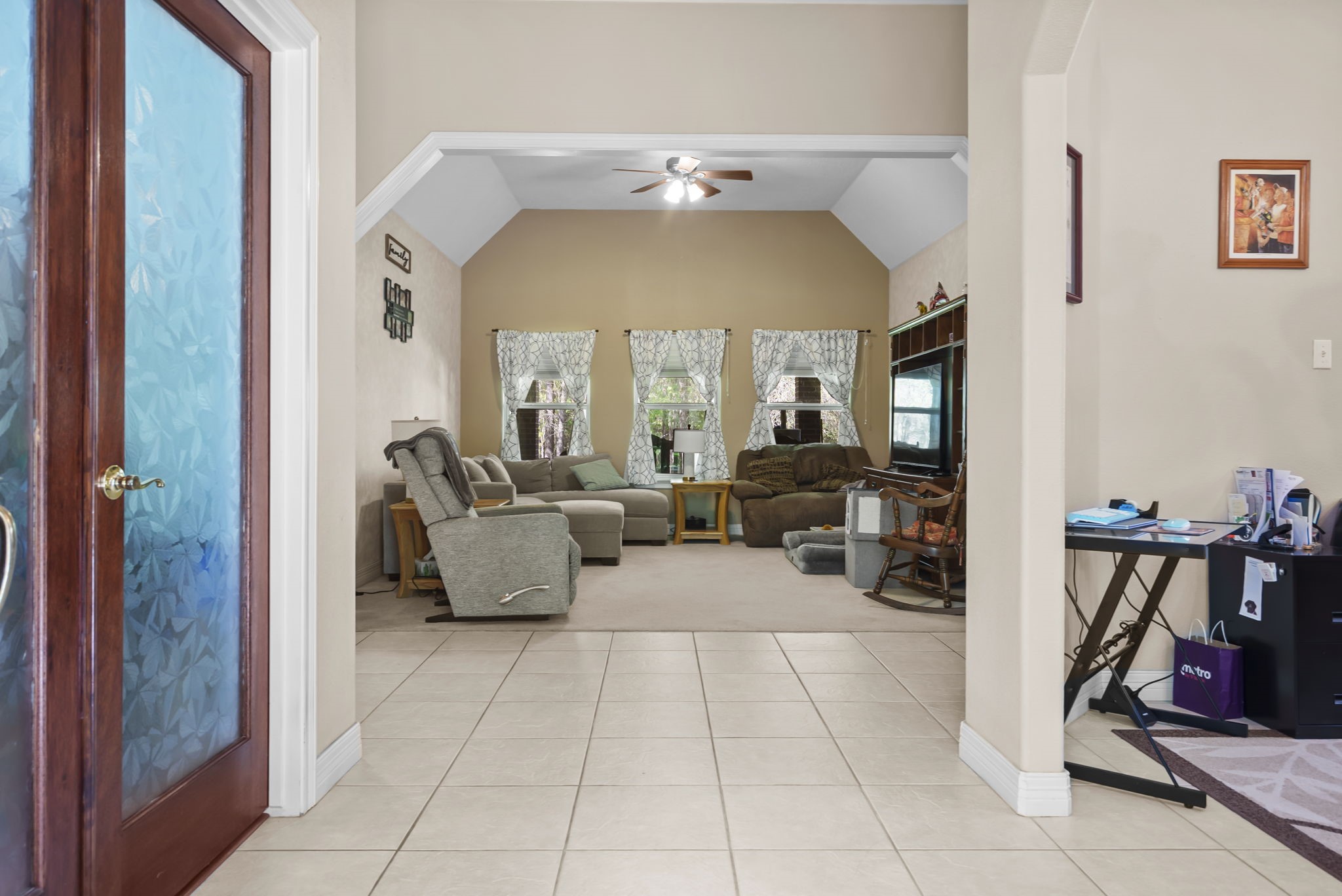 15524 Jim Branch Road Dayton, TX 77535 - Photo 4 of 40 a living room with furniture and a dining table with garden view