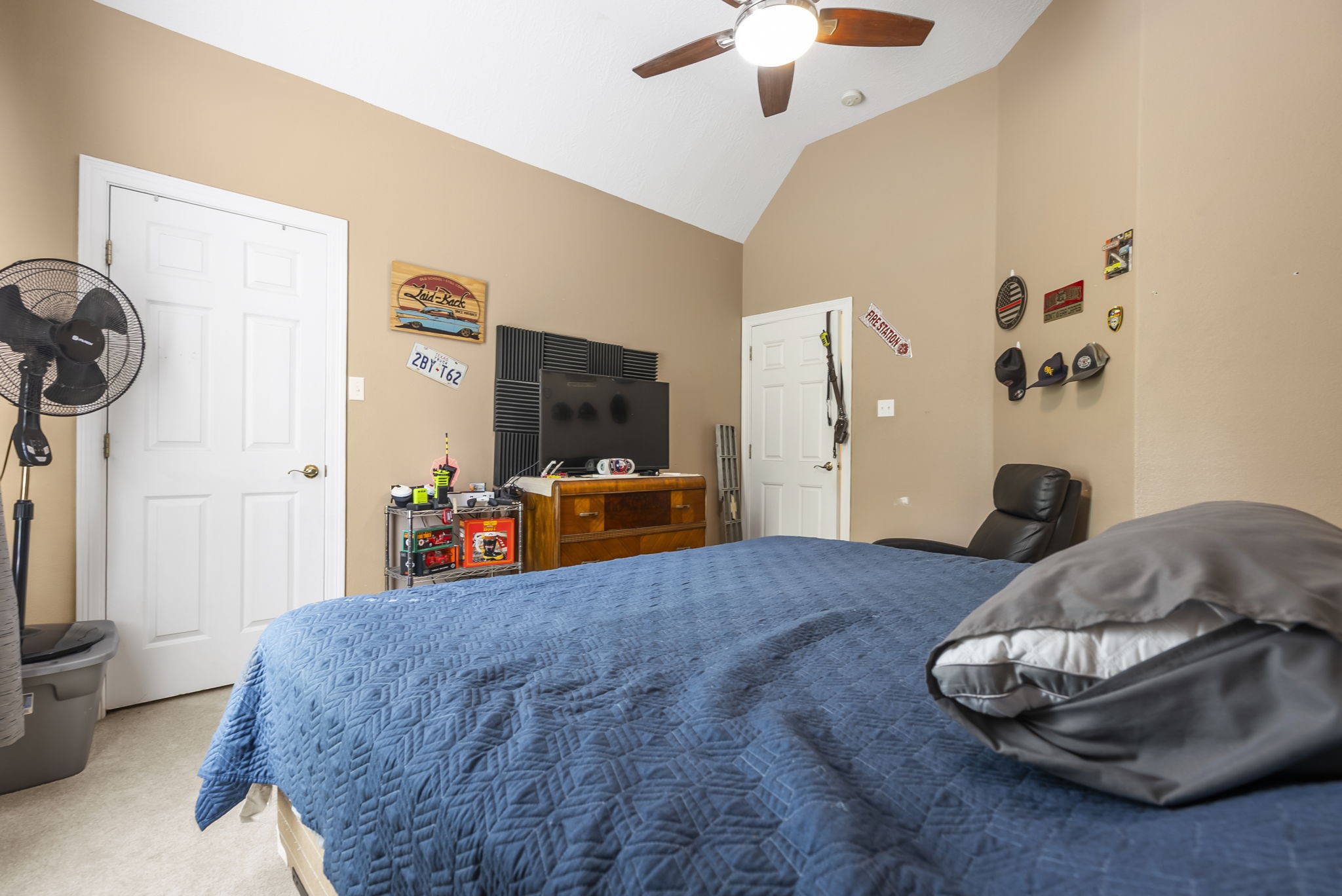 15524 Jim Branch Road Dayton, TX 77535 - Photo 8 of 40 a bedroom with a bed and a chandelier