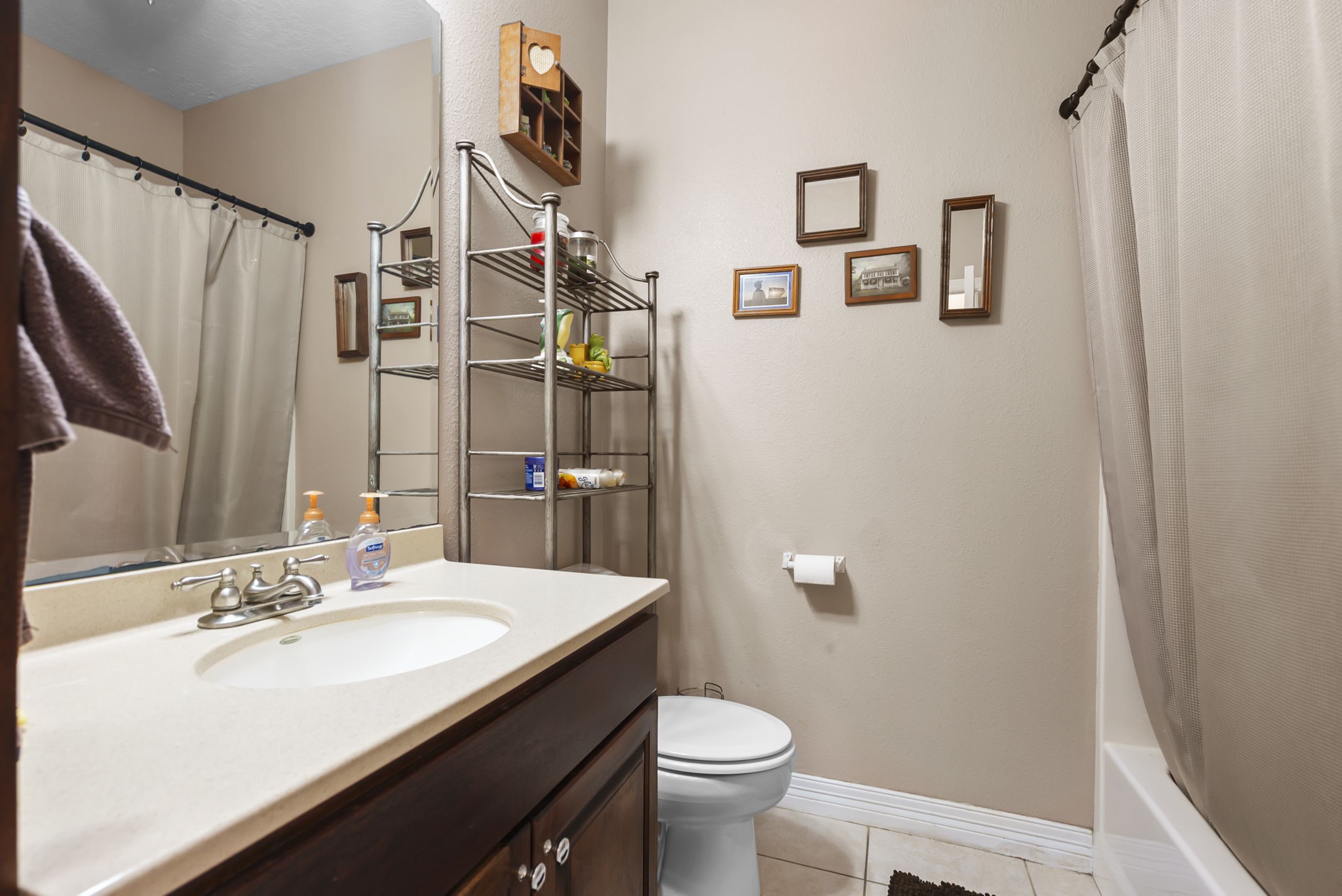 15524 Jim Branch Road Dayton, TX 77535 - Photo 9 of 40 a bathroom with a sink toilet and shower