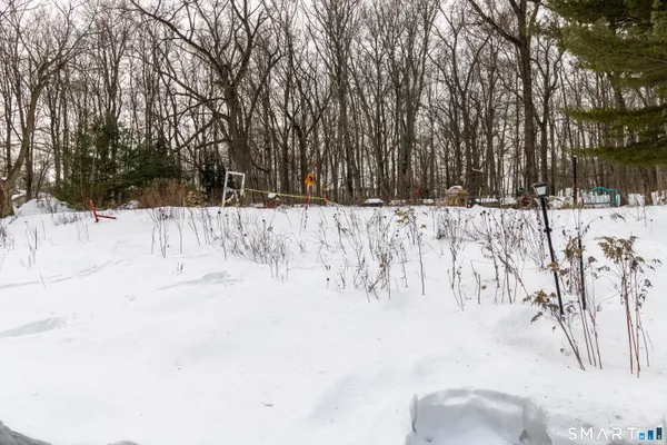 a view of a yard with snow on