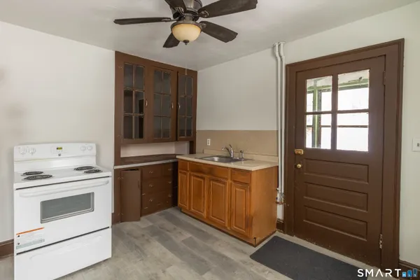a kitchen with a stove and a sink