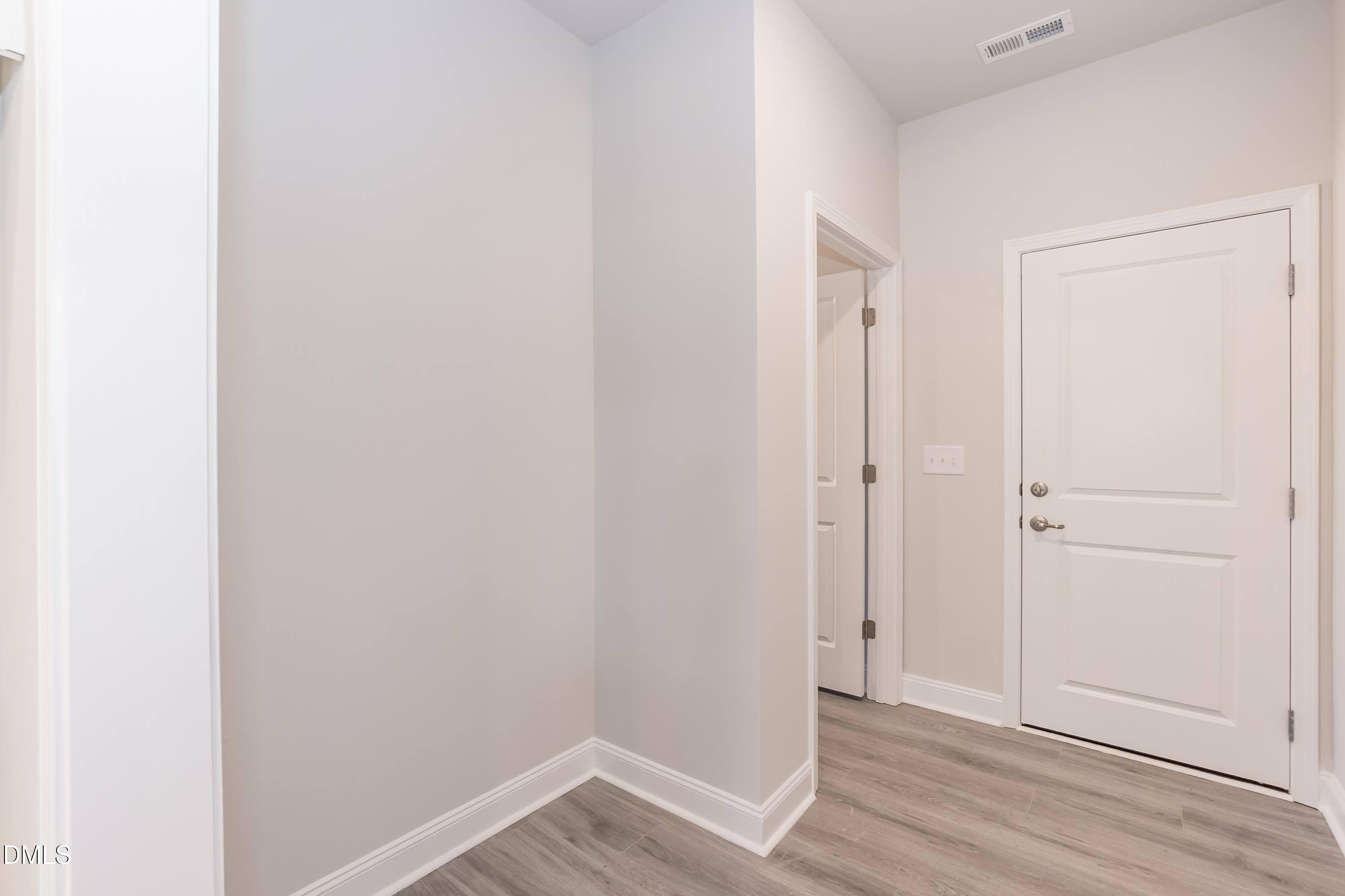 49 Galway Road Lillington, NC 27546 - Photo 17 of 39 a view of an empty room with wooden floor