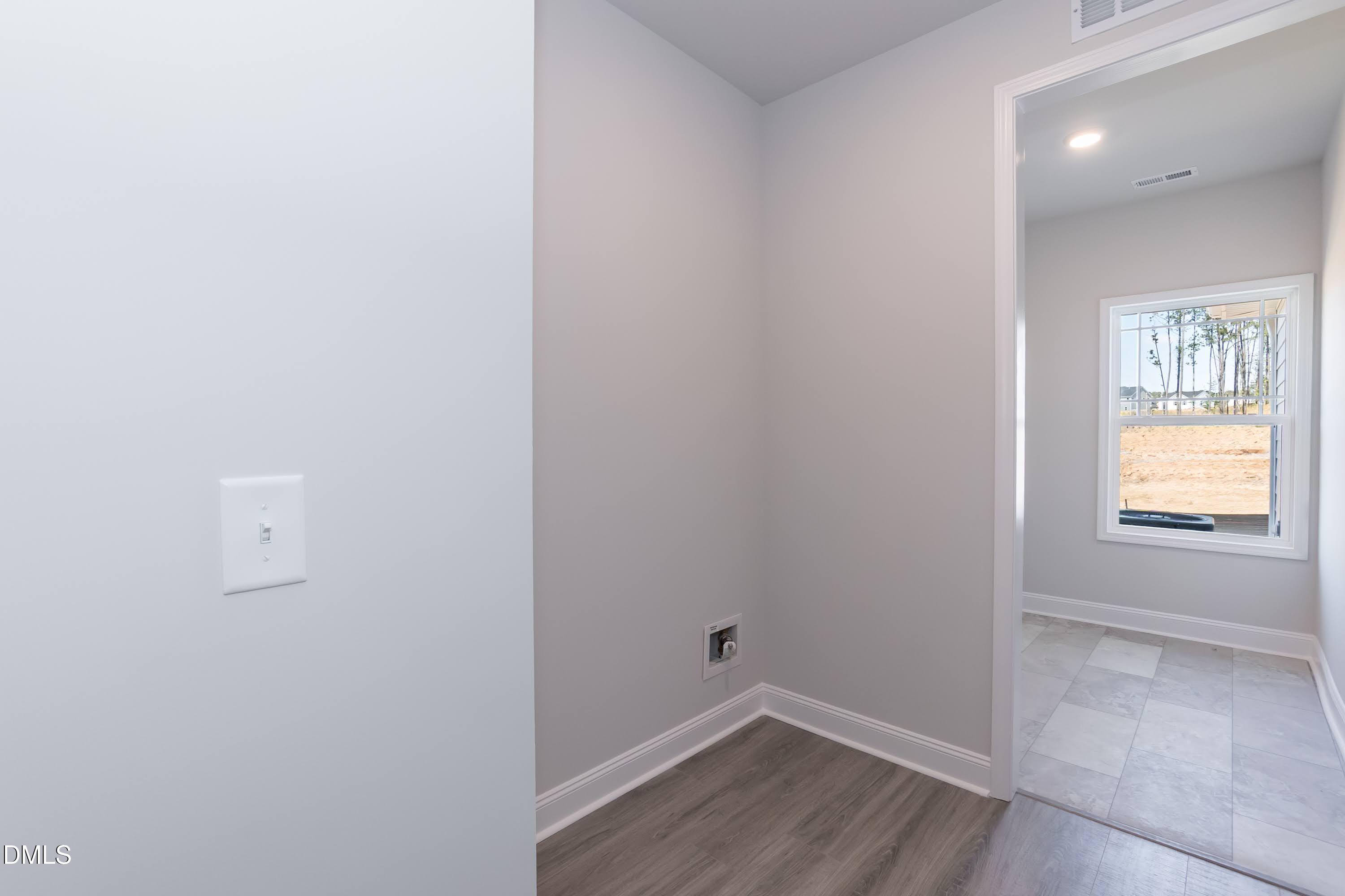 49 Galway Road Lillington, NC 27546 - Photo 18 of 39 a view of hallway with window and wooden floor
