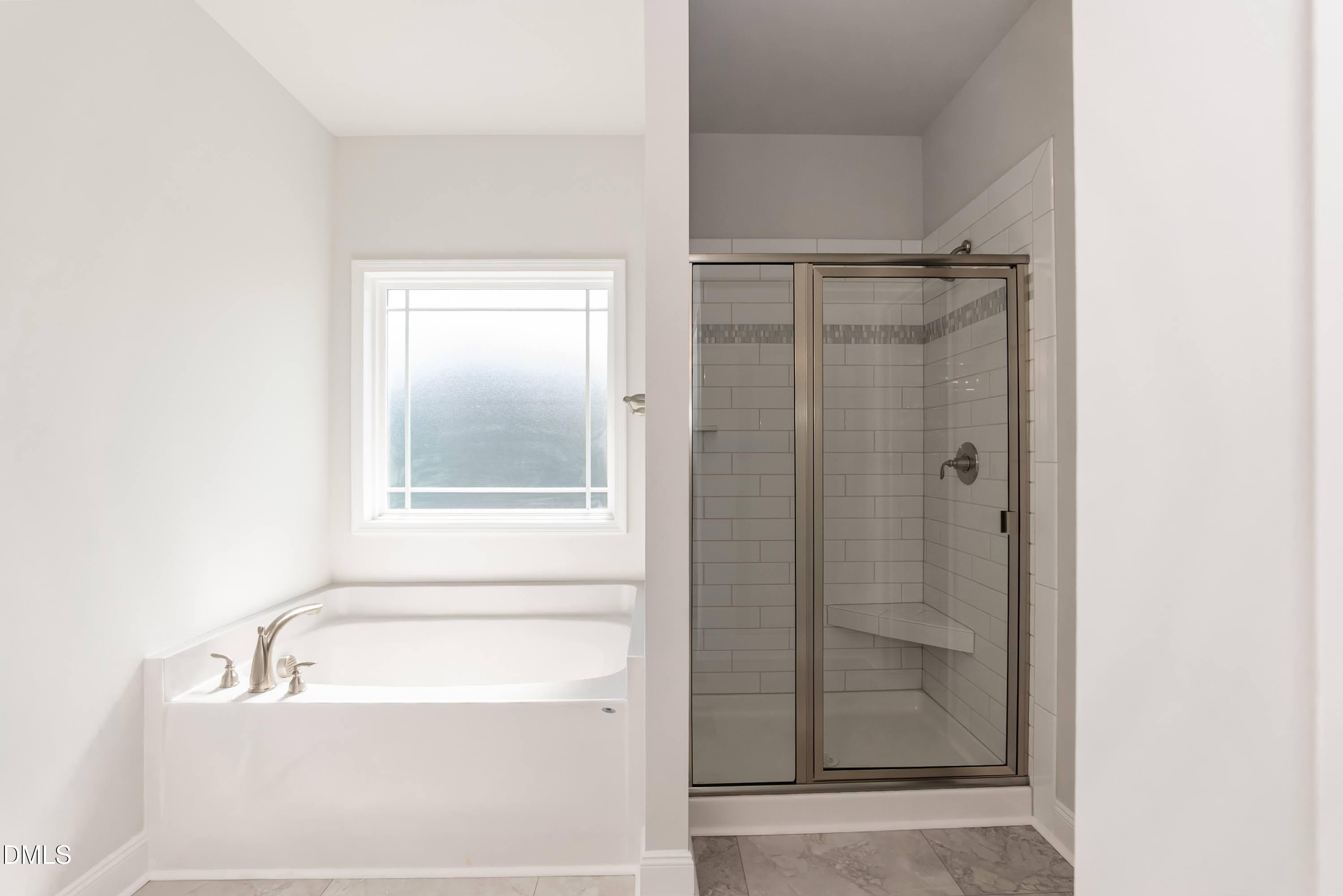 49 Galway Road Lillington, NC 27546 - Photo 25 of 39 a bathroom with a tub shower and sink