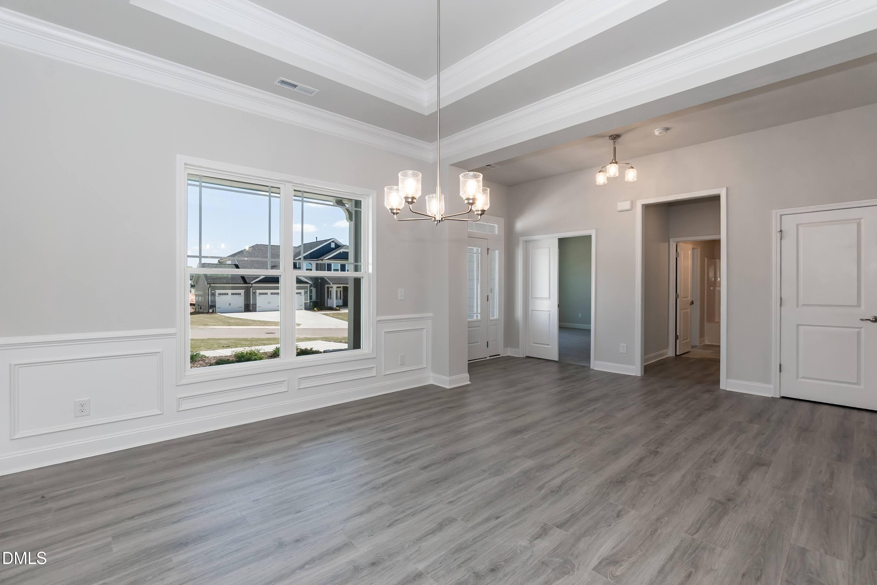 49 Galway Road Lillington, NC 27546 - Photo 5 of 39 a view of an empty room with window and wooden floor