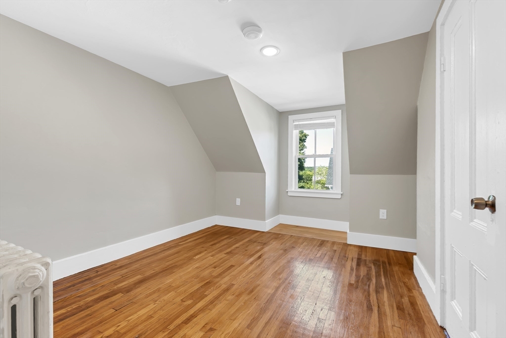 28 Evergreen Street, Unit 3 Boston, MA 02130 - Photo 8 of 16 a view of empty room with wooden floor and fan