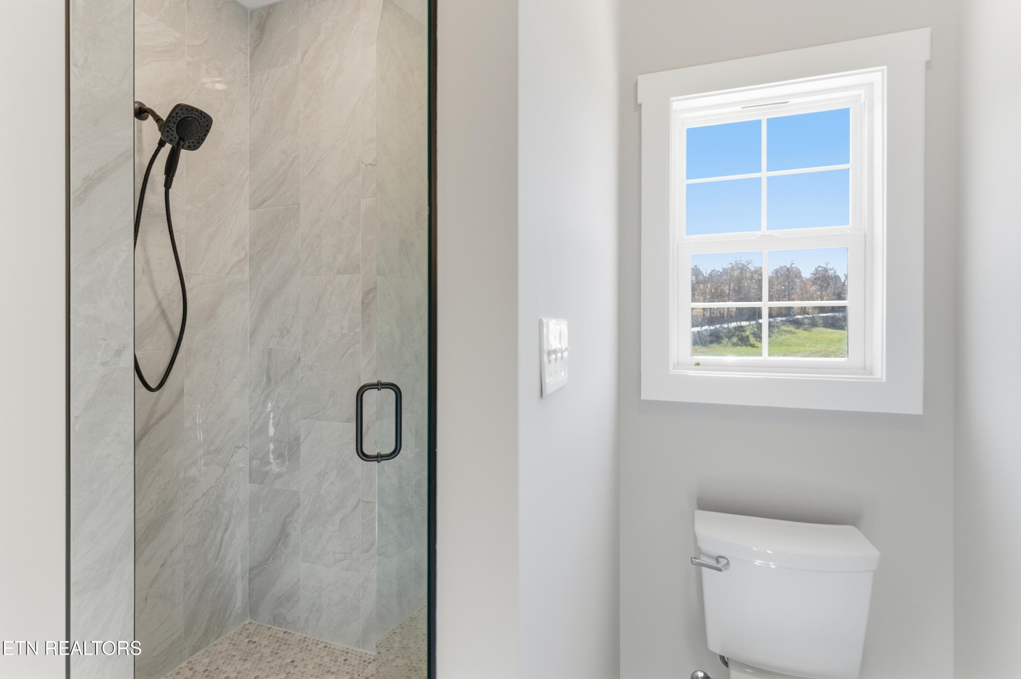 153 Washita Lane Rutledge, TN 37861 - Photo 21 of 44 a bathroom with a bath tub and a window