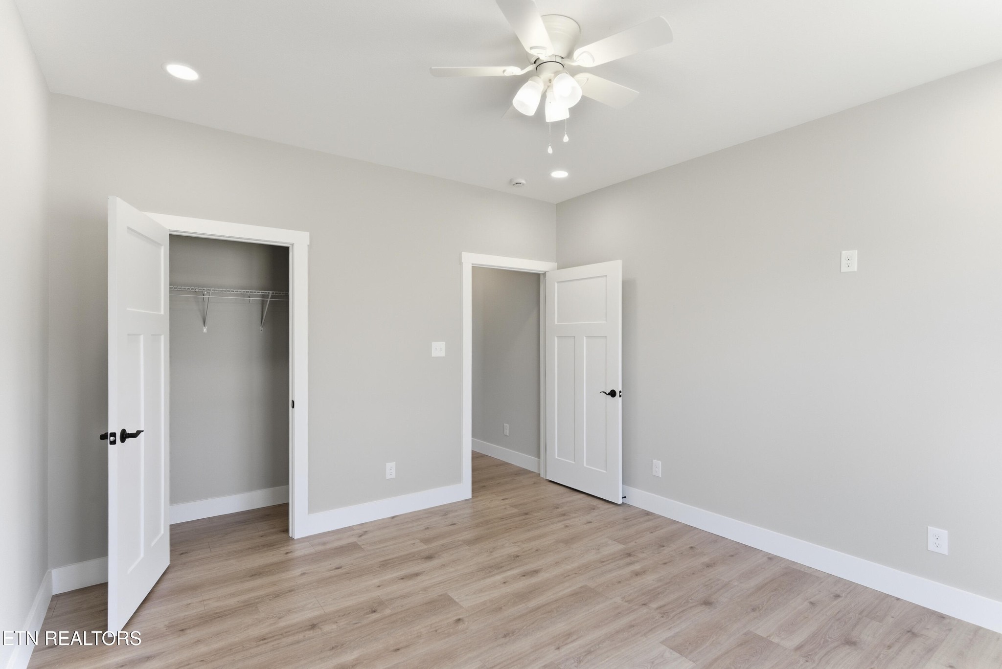 153 Washita Lane Rutledge, TN 37861 - Photo 29 of 44 an empty room with wooden floor and ceiling fan