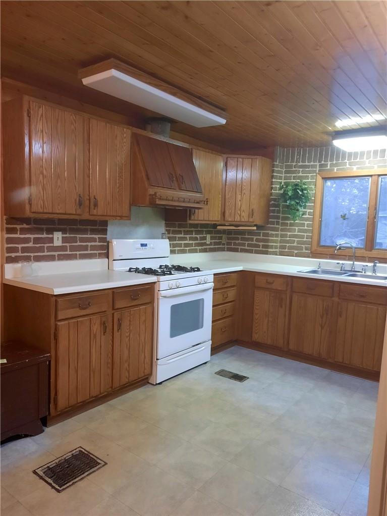 11 Chapman Circle Poughkeepsie, NY 12601 - Photo 1 of 1 a kitchen with stainless steel appliances granite countertop a stove sink and cabinets