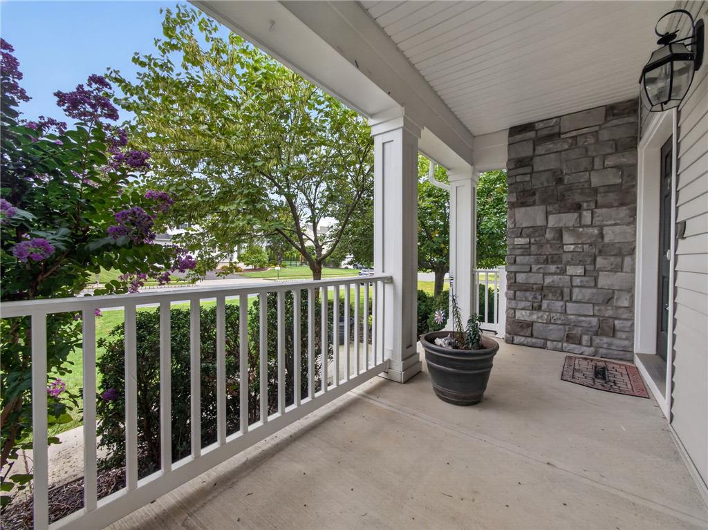 2765 Farmstead Road Easton, PA 18040 - Photo 5 of 50 A welcoming front porch, accented by stone siding and mature landscaping, invites guests inside.