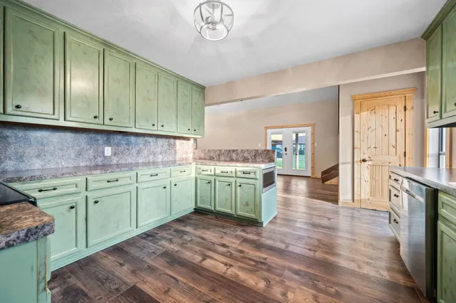 a kitchen with cabinets a sink and dishwasher