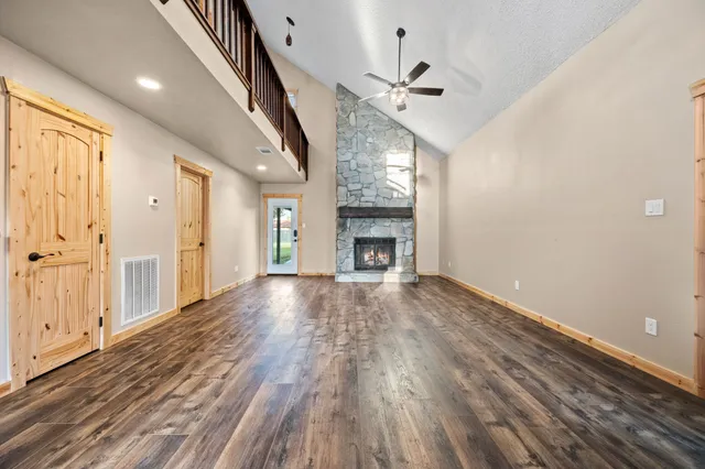 wooden floor in an empty room with a fireplace