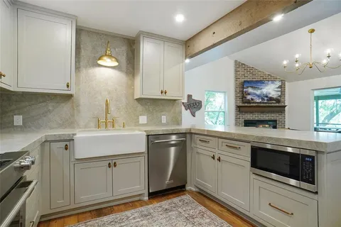 a view of a house with a yard and sitting area