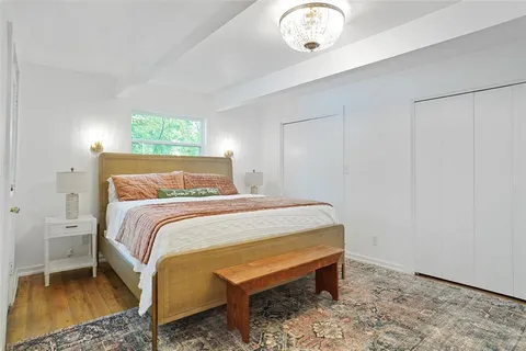 a kitchen with stainless steel appliances a stove a refrigerator and cabinets