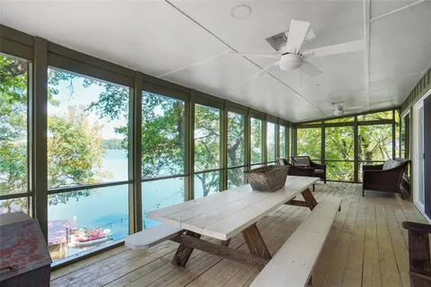 a bathroom with a sink vanity tub shower and a mirror