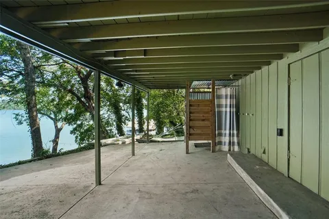 a balcony with furniture and a ceiling fan