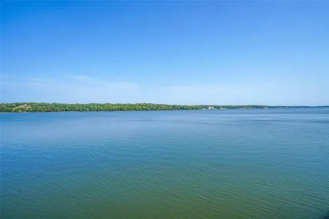 a view of a patio with table and chairs